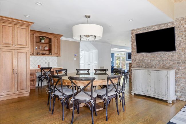 Dining space with recessed lighting, dark wood finished floors, and ornamental molding | Image 17