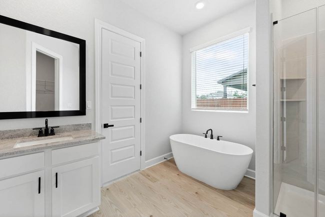 Relax in the large soaking tub or enjoy the spacious, standing shower. | Image 6