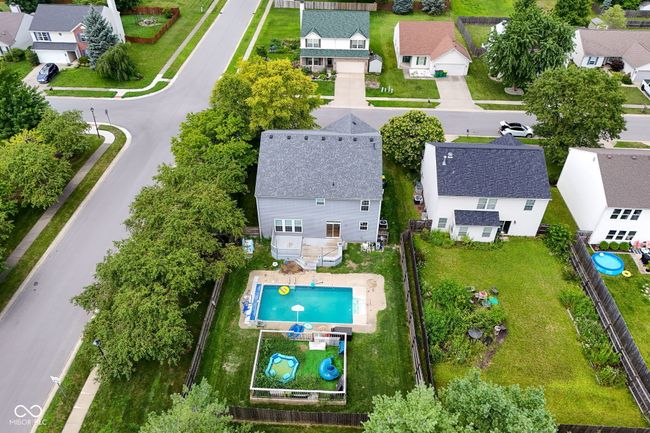 aerial view of residential area with a pool | Image 50