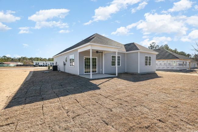 Back of property featuring ceiling fan, a patio, and central AC unit | Image 28