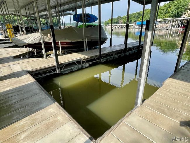 Dock with a water view and boat lift | Image 98