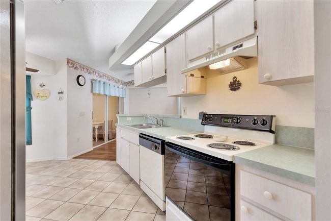 Kitchen with view of dining | Image 9