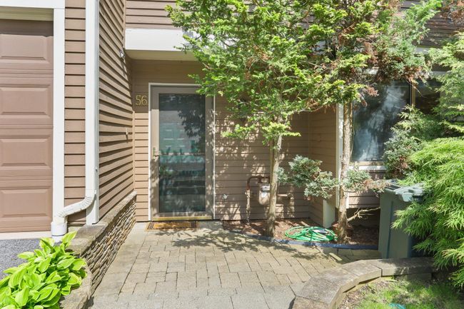 Doorway to property with a patio area and a garage | Image 35