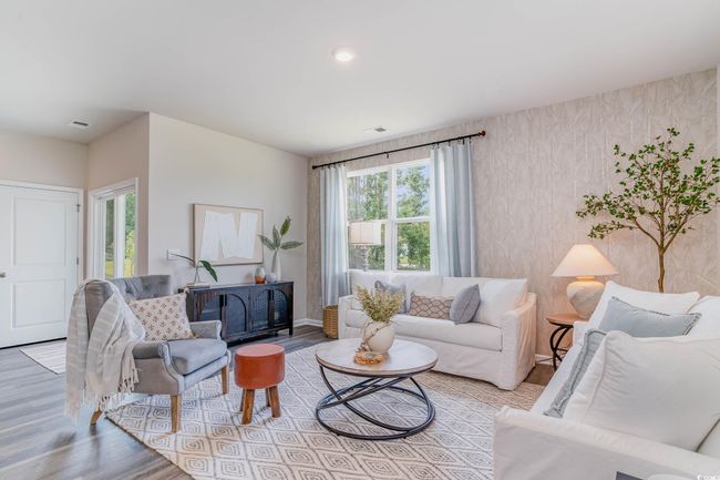 Living room with wood finished floors and baseboards | Image 9