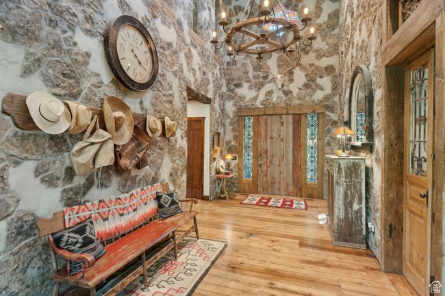 Foyer entrance featuring a chandelier and hardwood / wood-style floors | Image 16