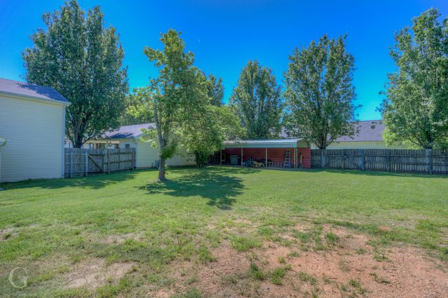 View of yard featuring a gate | Image 26
