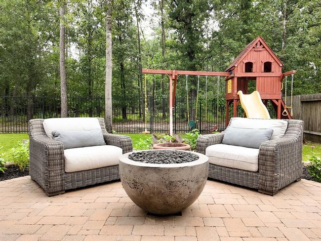Fire pit is fueled by covered propane tank | Image 24