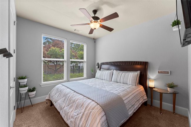 On the opposite side of the home, two secondary bedrooms provide comfort and quiet space. | Image 31