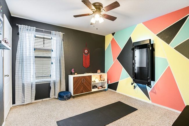 Workout area with a ceiling fan | Image 24