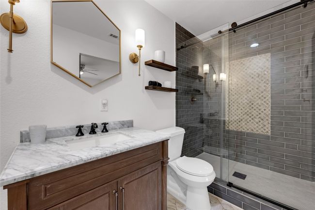 Bathroom with a walk in shower, marble vanity | Image 20
