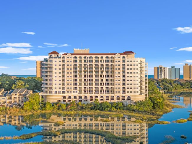 View of building exterior with a water view | Image 39