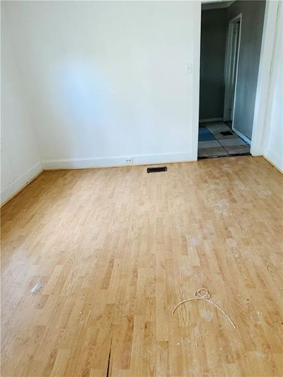 Spare room featuring hardwood / wood-style flooring | Image 2