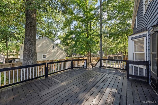 Wooden terrace with a shed and a fenced backyard | Image 37