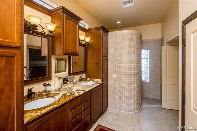 Full bathroom featuring tile patterned flooring, double vanity, and walk in shower | Image 50