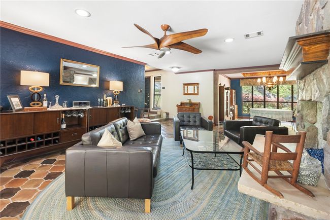 Living area featuring recessed lighting, visible vents, ceiling fan with notable chandelier, and ornamental molding | Image 18
