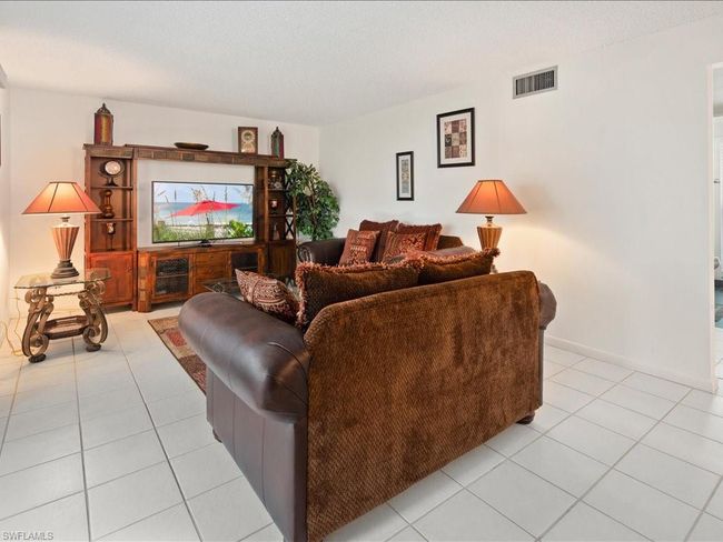 Living area with and light tile patterned floors | Image 20