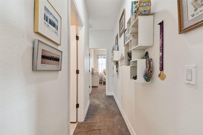 Hallway to secondary bedrooms & guest bath. | Image 20
