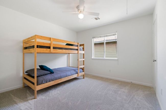 The first of two secondary rooms on the second level offers an escape from activities below. | Image 20