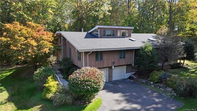 View of front facade featuring a garage | Image 1