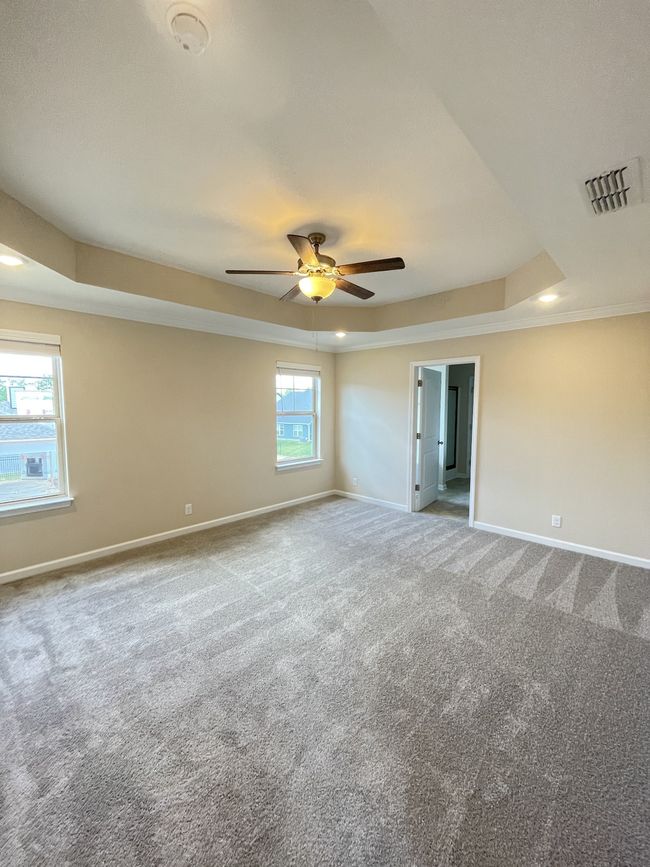 Primary bedroom with trey ceilings | Image 11