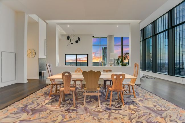 Elegant lighting defines the dining zone while maintaining the open-concept feel of the penthouse. | Image 10