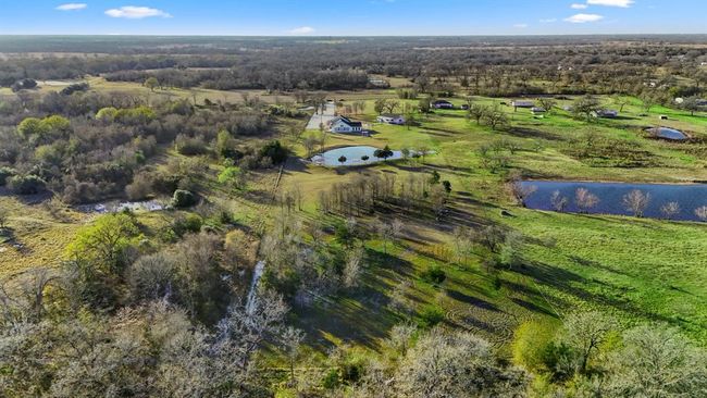 An aerial perspective highlights the property’s 7 acres—offering space, privacy, and endless potential to make it your own. | Image 43