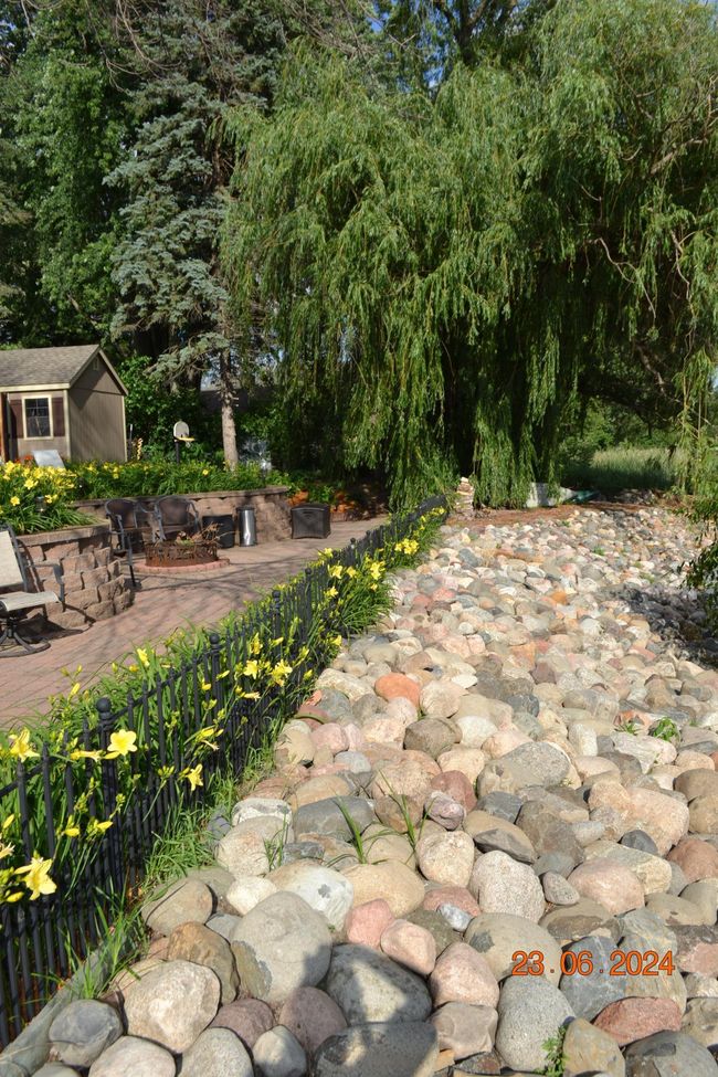 Rocky shoreline that is overlooked by the expansive patio | Image 53