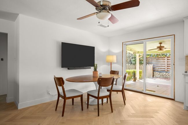 Dining area featuring ceiling fan, visible vents, and baseboards | Image 18