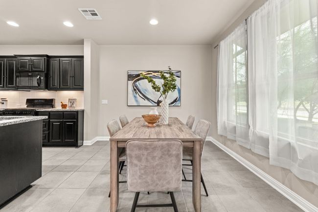 Dining area featuring recessed lighting and light tile patterned flooring | Image 12