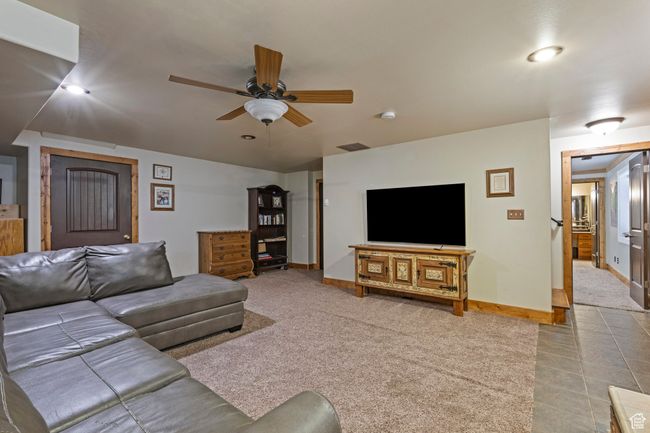 Basement family room with gas fireplace | Image 21