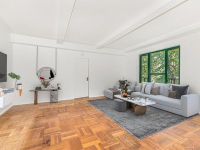 Living room with light parquet flooring and beam ceiling | Image 1