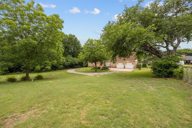 View of green lawn with a garage | Image 29