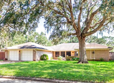 Front view, landscaped yard, beautiful trees | Image 2