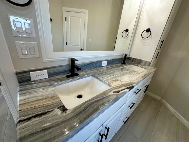 Full bathroom featuring double vanity and baseboards | Image 15