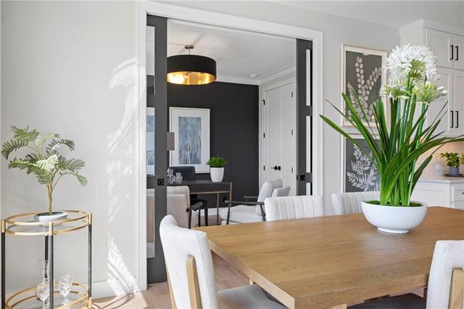 The dining area offers plenty of space for a large table. | Image 17