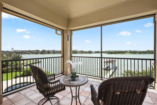 Enjoy this tranquil setting as you step out onto your screened in porch with your first round of coffee from the Primary suite coffee bar. | Image 33