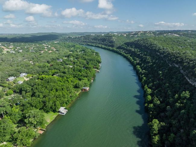 Drone / aerial view of a forest and a large body of water | Image 29