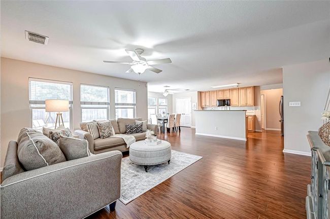 You'll enjoy the open concept area with the living room, kitchen and eating area. | Image 5