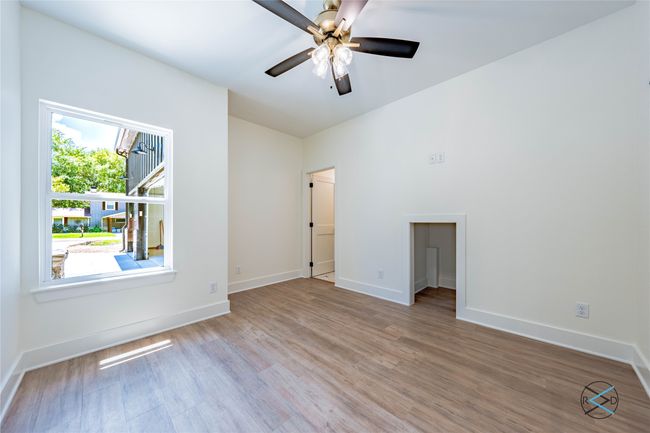 Unfurnished room with ceiling fan and light wood-type flooring | Image 6