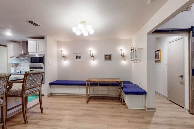 Custom banquette seating area between living room and kitchen | Image 9