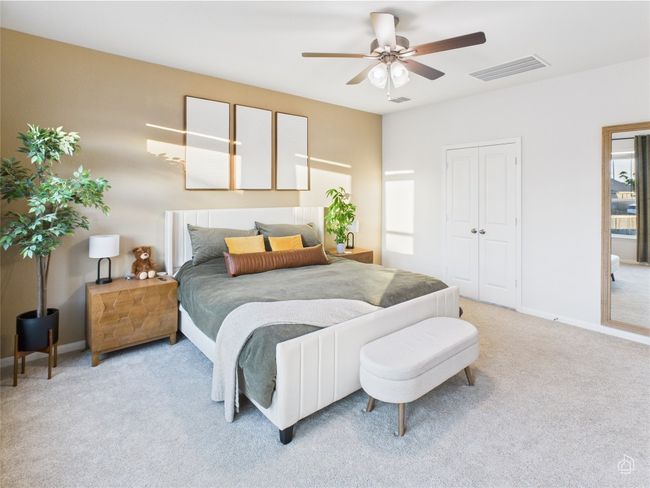 Bedroom featuring light carpet, baseboards, a ceiling fan, and a closet | Image 22