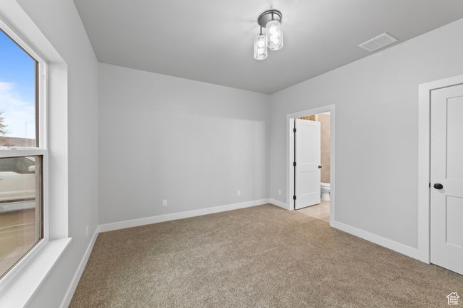 Empty room with baseboards, carpet floors, and visible vents | Image 27