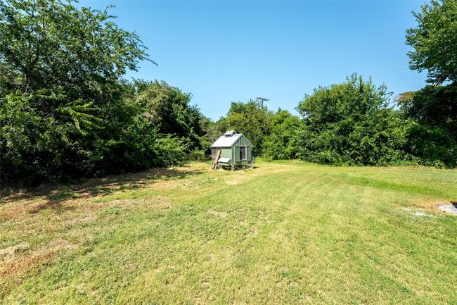 View of grassy yard with an outdoor structure | Image 16