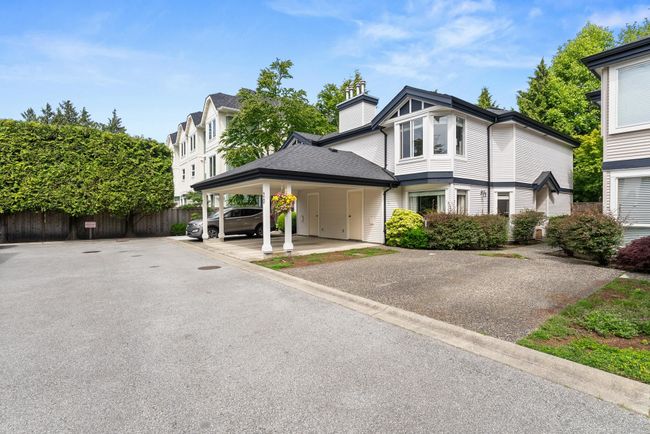 View of front facade featuring a chimney | Image 6
