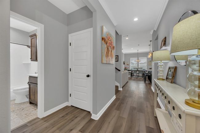 Corridor featuring recessed lighting, crown molding, baseboards, and wood finished floors | Image 5