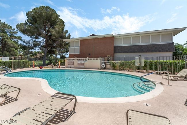 Community pool with a patio | Image 26