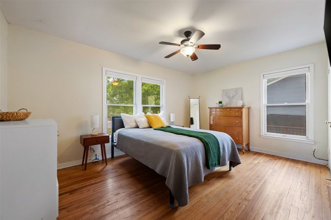 Original hardwoods throughout primary bedroom. | Image 18