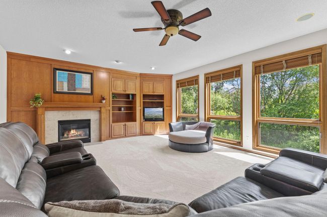 Large family room with new carpeting a fireplace | Image 12