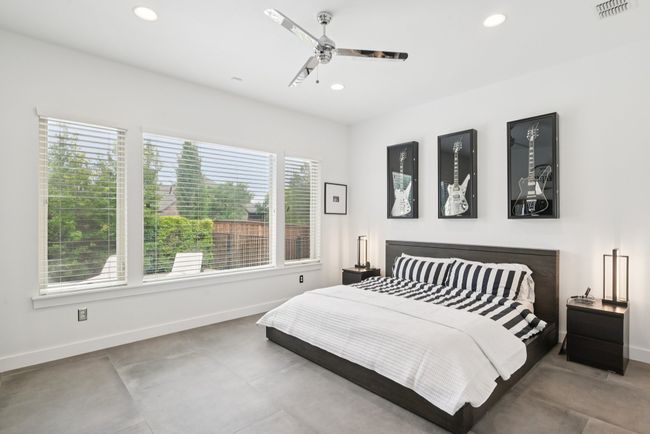 Bedroom with recessed lighting, concrete flooring, and a ceiling fan | Image 12