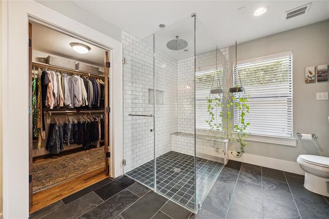 Large walk-in closet in primary bedroom. | Image 9